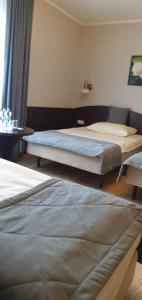 Łóżko lub łóżka w pokoju w obiekcie Pokoje De Luxe Figaro