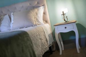 Łóżko lub łóżka w pokoju w obiekcie B&B Gli Archi