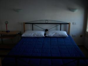 Postel nebo postele na pokoji v ubytování Appartamento Sonia
