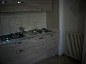 Kuchyň nebo kuchyňský kout v ubytování Appartamento Sonia