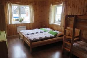 Postel nebo postele na pokoji v ubytování Apartments Skiareál U Vodárny Bedřichov + 37 fotografií