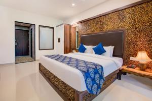 a bedroom with a large bed in a room at Club Mahindra Netrang in Netrang +37 photos