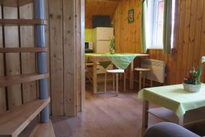 a kitchen and dining room with a table and chairs at Apartments Skiareál U Vodárny Bedřichov in Janov nad Nisou