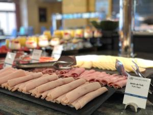 a bunch of hot dogs on display in a kitchen at Perla Marina in Nerja