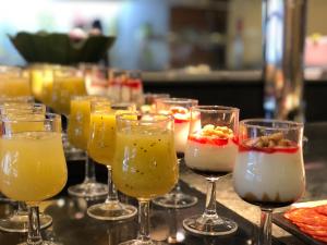 a row of wine glasses filled with different types of drinks at Perla Marina in Nerja
