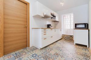 Kuchyňa alebo kuchynka v ubytovaní Miralmar Apartamento + 15 fotografií