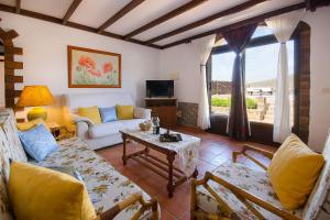 a living room with a couch and a table at Villa Clara 2 in Masdache