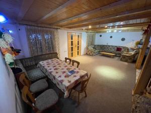 a living room with a table and a couch at Freemont in Braşov