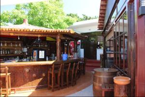 a bar in a restaurant with a wooden counter at Asterias Bay-Theologos in Theologos
