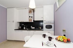 Kuchyňa alebo kuchynka v ubytovaní Apartments Gaura