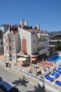 a view of a resort with a pool and umbrellas at BASILS APART HOTEL in Marmaris