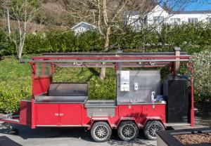 a red truck is parked in a parking lot at The Lodge at Woodenbridge in Arklow