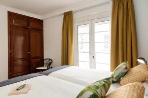 Ένα ή περισσότερα κρεβάτια σε δωμάτιο στο Arizona Apartment