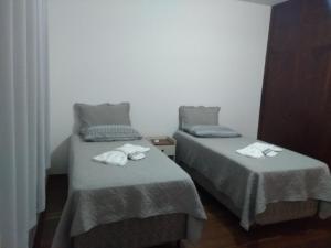 Un ou plusieurs lits dans un hébergement de l'établissement LM HOTEL ARAÇATUBA