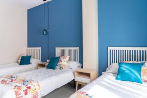 Postel nebo postele na pokoji v ubytování Hotel Aubí