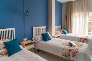 Postel nebo postele na pokoji v ubytování Hotel Aubí