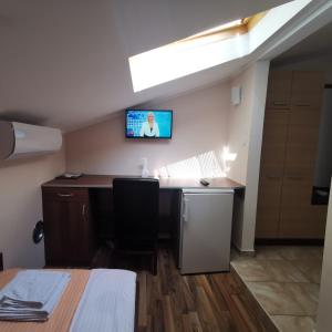 TV a/nebo společenská místnost v ubytování Kafana Zlatna Ribica