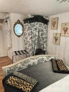 a room with a bed with a window and a window at Olivia House in Porthcawl