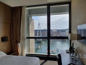 a hotel room with a view of the ocean at Hotel Spa Le Pasino in Le Havre