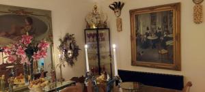 a room with a table and a picture on the wall at Olivia House in Porthcawl