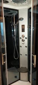 a shower with a shower head in a bathroom at Olivia House in Porthcawl