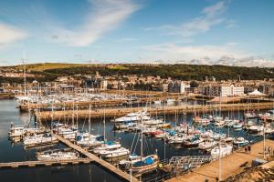 a bunch of boats docked in a harbor at Georgian House Hotel in Whitehaven