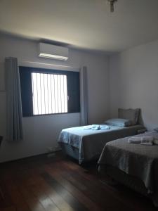 Posteľ alebo postele v izbe v ubytovaní LM HOTEL ARAÇATUBA