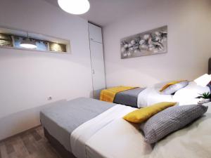 Postel nebo postele na pokoji v ubytování Apartment Herc
