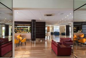 a lobby with a bar in a building at Virgilio Grand Hotel in Sperlonga
