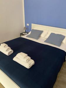 Postel nebo postele na pokoji v ubytování Nenetta Rooms & Suites Monopoli
