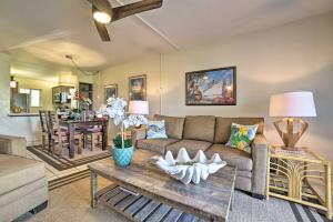 a living room with a couch and a table at Ocean-View Kihei Condo with Lanai Steps to Beach! in Kihei