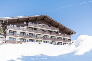 a building with snow in front of it at Haus Kreidl - Top 38 in Königsleiten