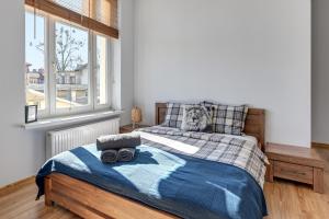 Łóżko lub łóżka w pokoju w obiekcie Blue Mandarin Apartments III Haffnera