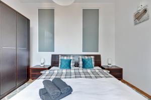 Łóżko lub łóżka w pokoju w obiekcie Blue Mandarin Apartments III Haffnera