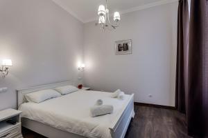 Кровать или кровати в номере InshiApartments on Dudajewa str