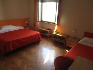 Postel nebo postele na pokoji v ubytování Affittacamere ACCASA