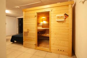 a wooden closet in a room with a bed in it at Villa Buena Vista mit beheiztem, abdeckbarem Pool und Sauna in Tijarafe