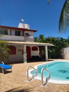 The swimming pool at or close to Pousada Caribe itacimirim