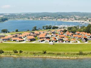 an aerial view of a housing estate next to the water at 6 person holiday home on a holiday park in Gr sten in Gråsten