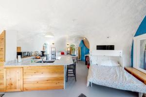 Voodi või voodid majutusasutuse McKenzie View Cottage toas