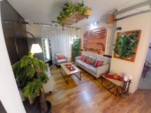 a living room with a couch and a table at Hotel Sagarnaga in La Paz