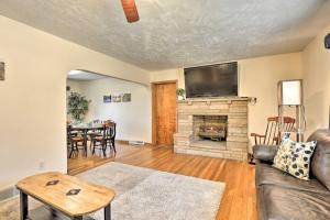 a living room with a couch and a fireplace at Mountaineer Retreat - 5 Mi to WV University! in Morgantown