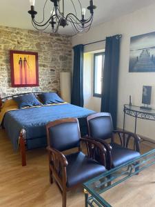 Postel nebo postele na pokoji v ubytování Chambres et table d'hôtes Le cèdre Aveyron