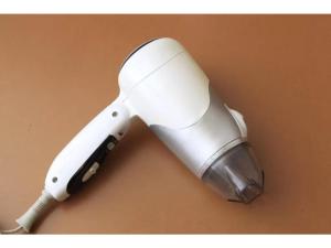 a white hair dryer sitting on top of a table at Fuji Green Hotel - Vacation STAY 18930v in Fuji