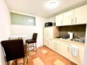Una cocina o zona de cocina en Pilatus Apartments