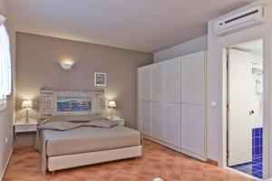 Aegean Village Beachfront Resort客房内的一张或多张床位