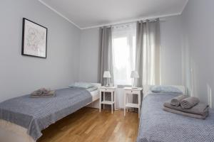 Posteľ alebo postele v izbe v ubytovaní CR Apartament Centrum Zamenhofa 1