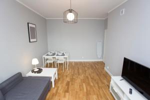 Televízia a/alebo spoločenská miestnosť v ubytovaní CR Apartament Centrum Zamenhofa 1