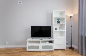 Televízia a/alebo spoločenská miestnosť v ubytovaní CR Apartament Centrum Zamenhofa 1