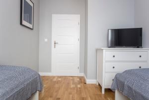 Posteľ alebo postele v izbe v ubytovaní CR Apartament Centrum Zamenhofa 1